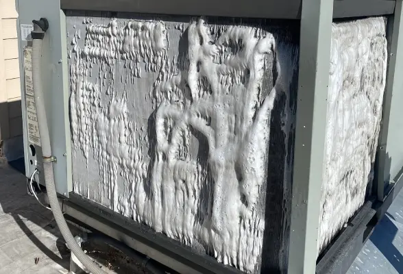 HVAC maintenance technician performing a seasonal tune-up in Bend, Oregon